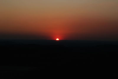 Scenic view of silhouette landscape against sky during sunset
