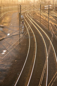 High angle view of railroad tracks by road in city