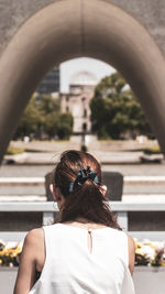 Rear view of woman with umbrella