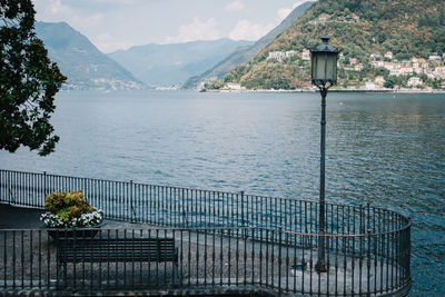 Scenic view of sea and mountains against sky