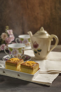 Cup of cake with ice cream on table