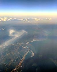 Aerial view of landscape against sky at sunset