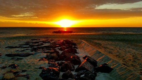 Scenic view of sea at sunset