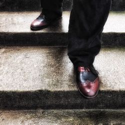 Low section of man standing on floor