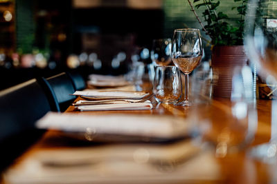 Luxury table settings for fine dining with and glassware, beautiful blurred background. 