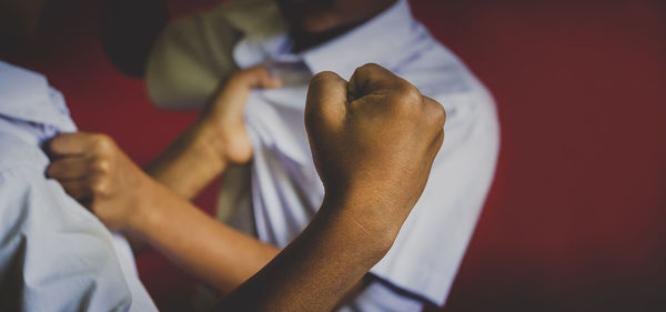 Close-up of hand holding white leaf