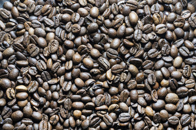 A background formed with some roasted coffee beans