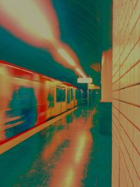 Train at railroad station at night