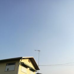 Low angle view of communications tower against clear sky