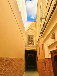 Narrow alley amidst buildings in city