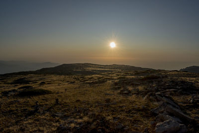 Scenic view of landscape against sky during sunset