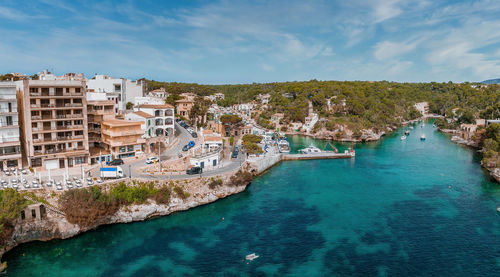 Aerial view of the porto colom fishing village in majorca.