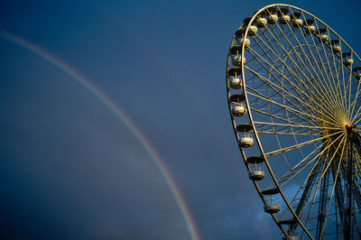 Low angle view of ferris wheel against sky