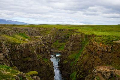 Scenic view of river amidst landscape against sky