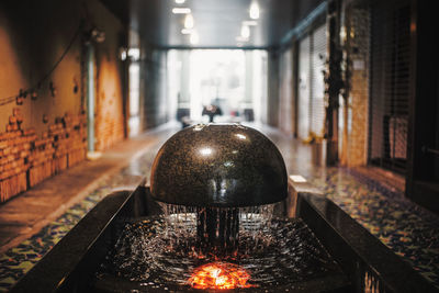 Close-up of illuminated lamp in building