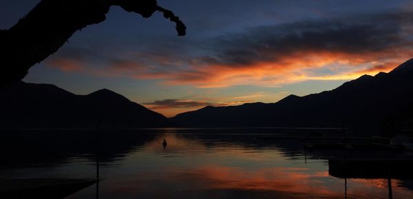 Scenic view of calm lake at sunset