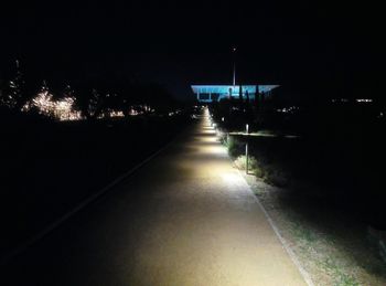 Illuminated lights against clear sky at night