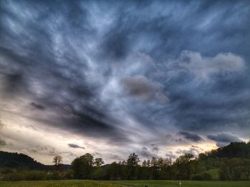 Scenic view of dramatic sky over land