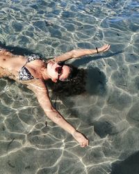 High angle view of woman swimming in pool