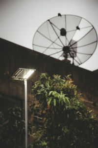 Low angle view of illuminated clock tower against sky