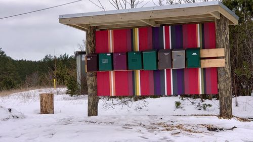 Built structure on field against sky during winter