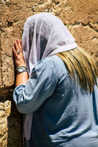 Rear view of woman standing outdoors