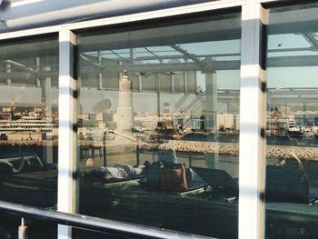 Reflection of people on glass window