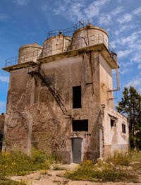 Low angle view of old building against sky