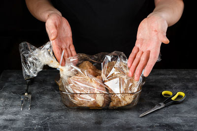 Close-up of person preparing food on table