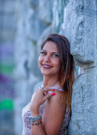 Portrait of smiling woman standing outdoors