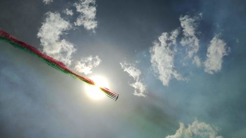 Low angle view of airshow against sky