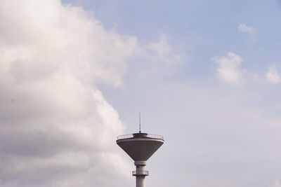 Low angle view of street light against cloudy sky