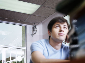 Man looking away at home