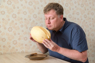 Side view of man eating food