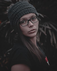 Portrait of young woman wearing hat