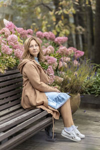 Young woman sitting on bench