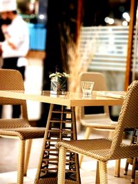 Empty chairs and tables in restaurant