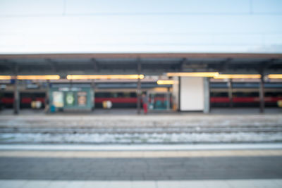 Train at railroad station platform against sky