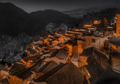 High angle view of illuminated buildings at night