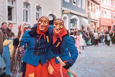 Portrait of people standing on street