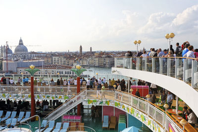 People on bridge in city