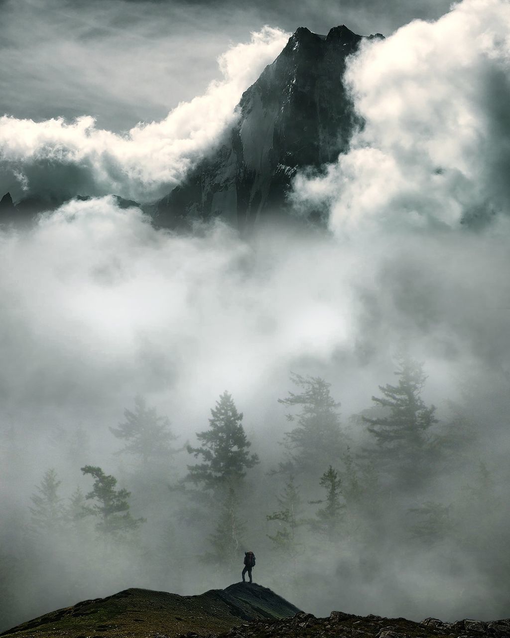 cloud - sky, beauty in nature, sky, fog, scenics - nature, nature, mountain, non-urban scene, one person, tranquil scene, land, real people, day, tree, tranquility, unrecognizable person, silhouette, environment, outdoors, power in nature