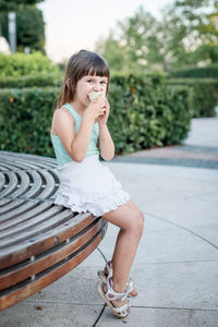 Portrait of a girl sitting outdoors