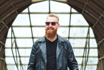 Portrait of young man standing outdoors