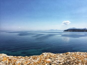 Scenic view of sea against blue sky