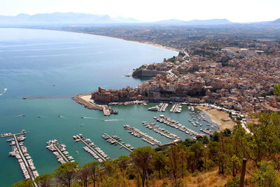 High angle view of sea and cityscape