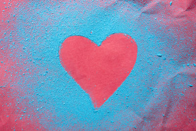 Heart shapes on blue wall