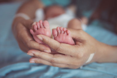 Low section of woman massaging customer