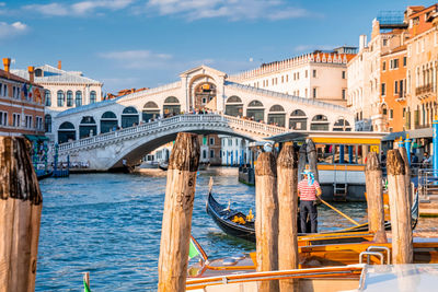 Traditional gondola near world famous canal grande and rialto bridge