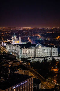 High angle view of illuminated buildings in city at night